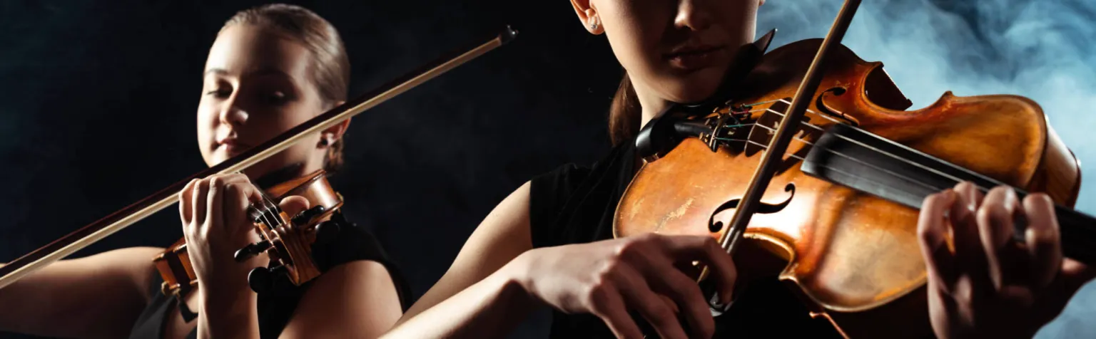 Two violinists performing